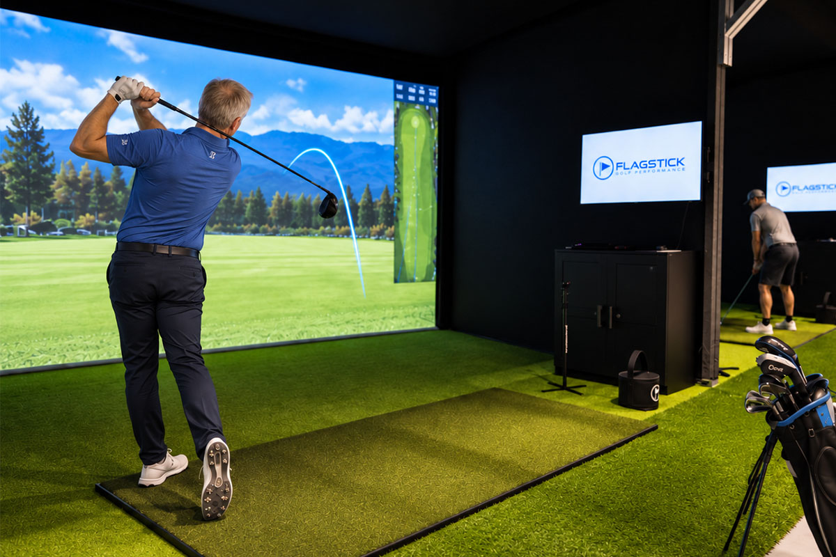 Phil Truono demonstrating a golf swing in a Flagstick simulator bay